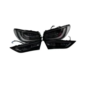 Full set of 4 handmade Infiniti Q60 black taillights Venom Series for 2018-2024 models on white background.