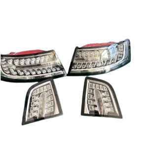 Product shot of AUDI A6 black taillights set for Audi A6 C6, showing the four-piece configuration.